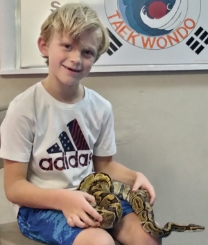 Judah holding Pauline, our female ball python.